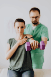 Physical therapist evaluating new patient during first session at Reform Physical Therapy.