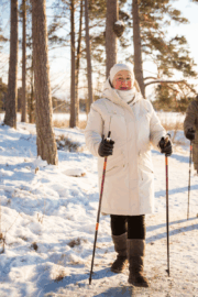 Person walking in cold weather to reduce winter joint stiffness.