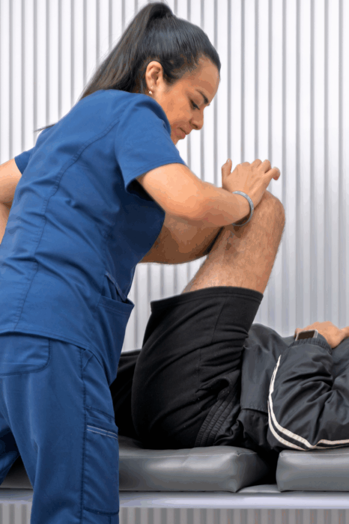 Movement testing performed during a physical therapy evaluation.