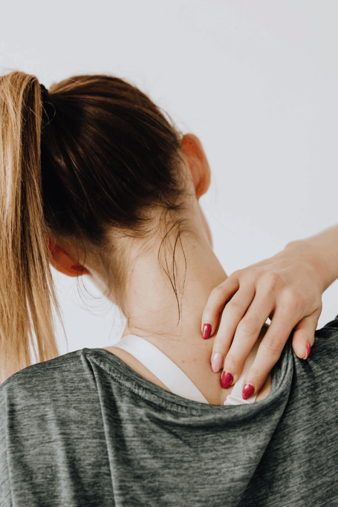 Adult experiencing jaw pain and neck tension.