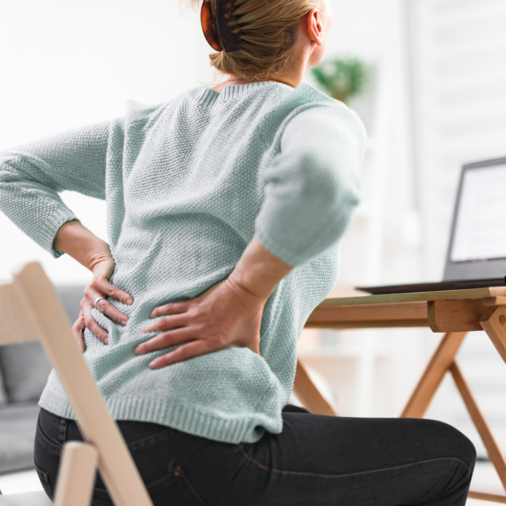 person sitting long hours leading to tight hips and back discomfort
