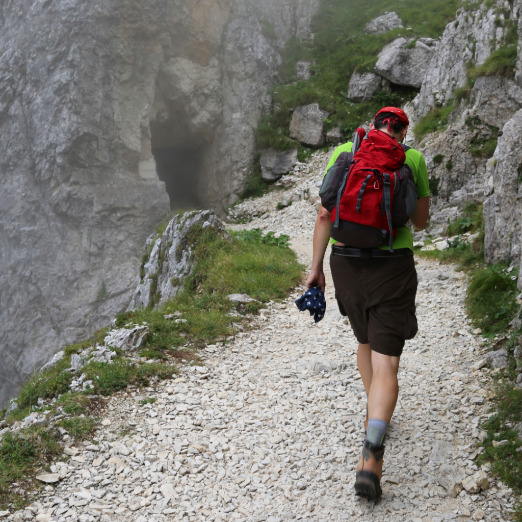 hiker walking on a Maine trail during early hiking season