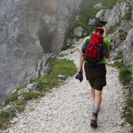 hiker walking on a Maine trail during early hiking season