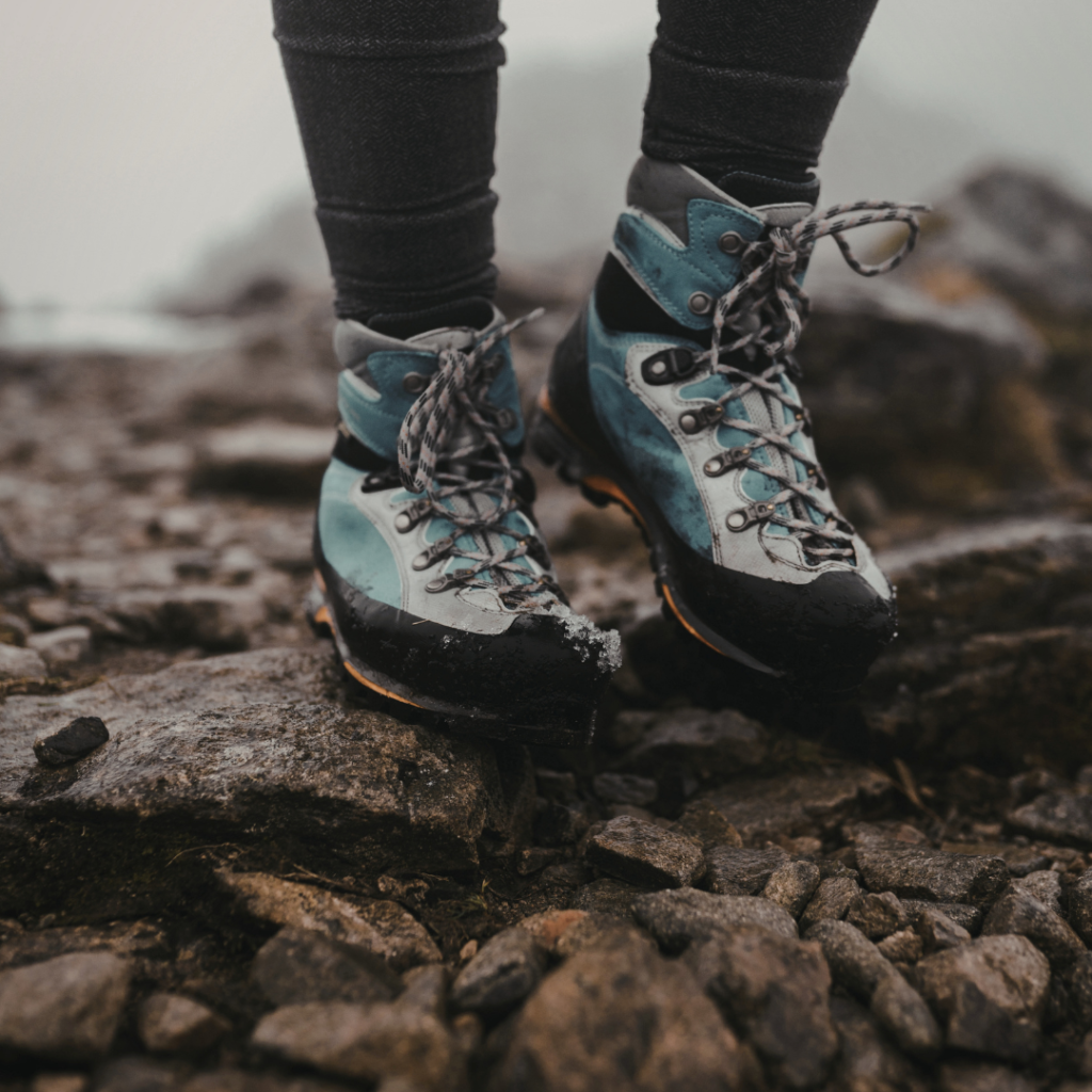 close up of hiking boots on uneven terrain