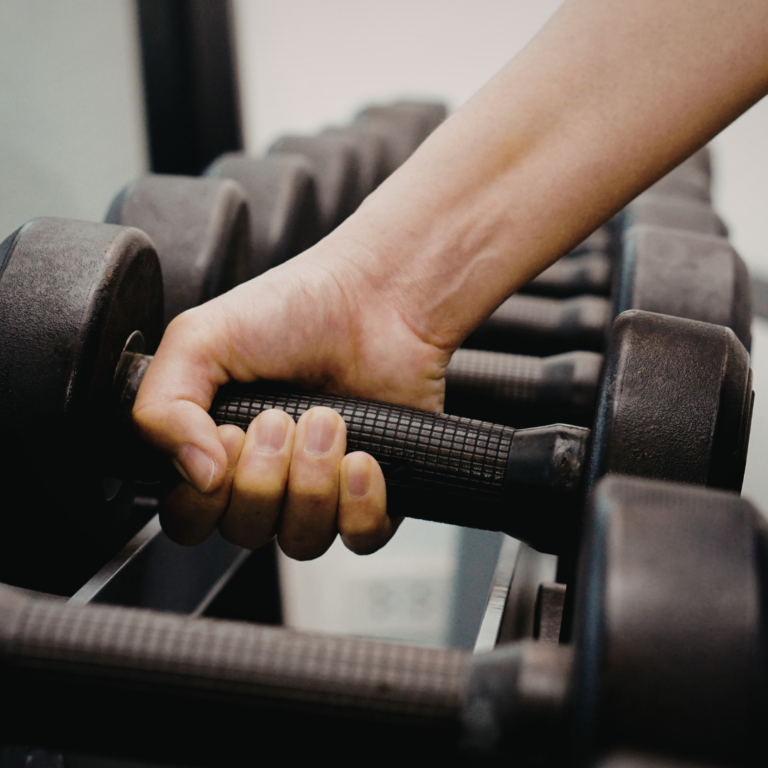 close up of weight training focusing on muscle control