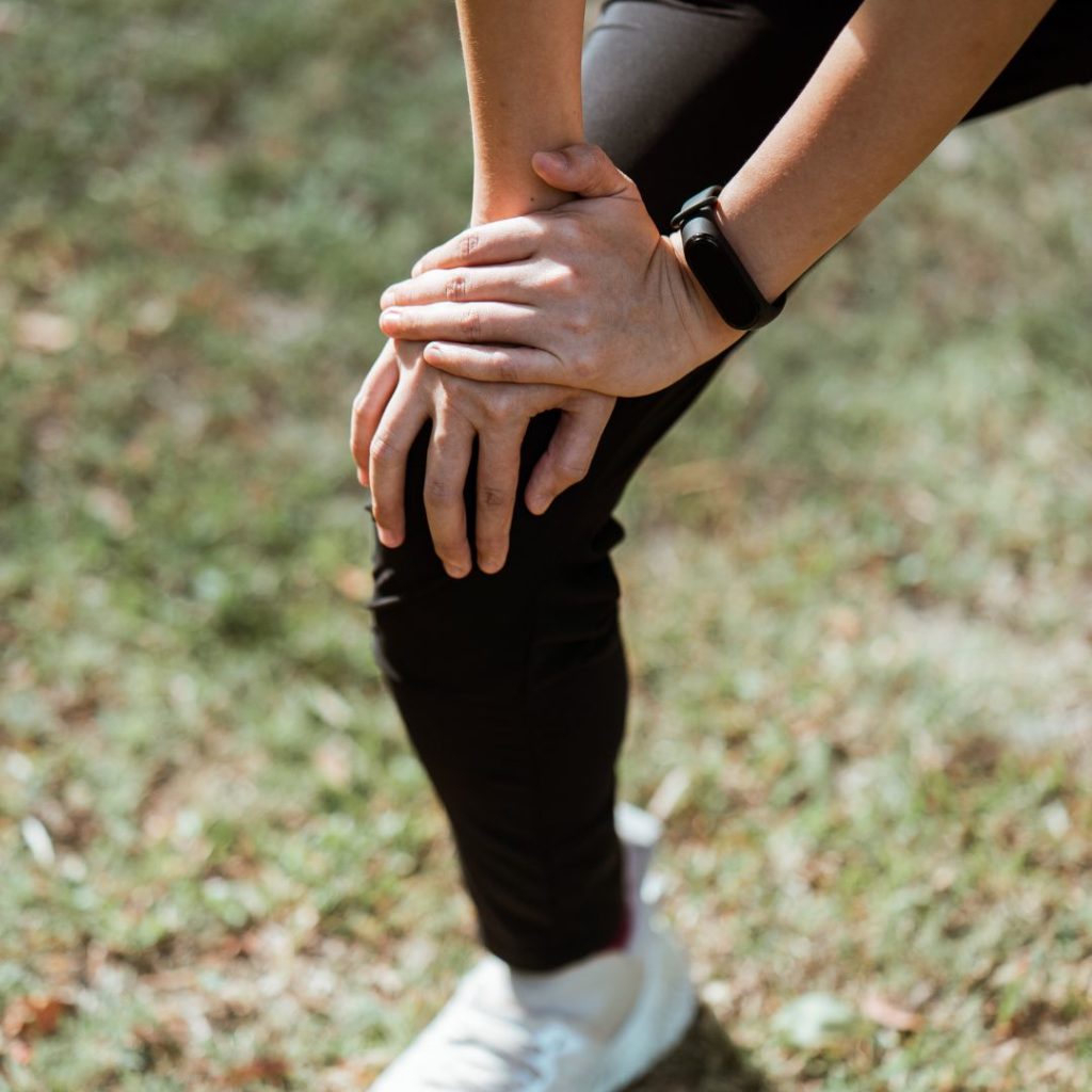 Woman holding his knee after activity due to joint pain