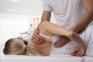 Woman receiving manual physical therapy